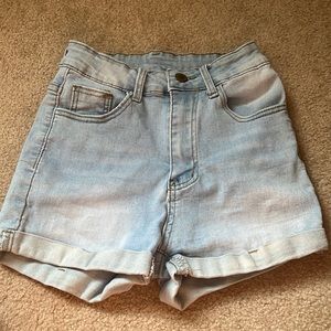 high waisted light blue rolled up denim shorts